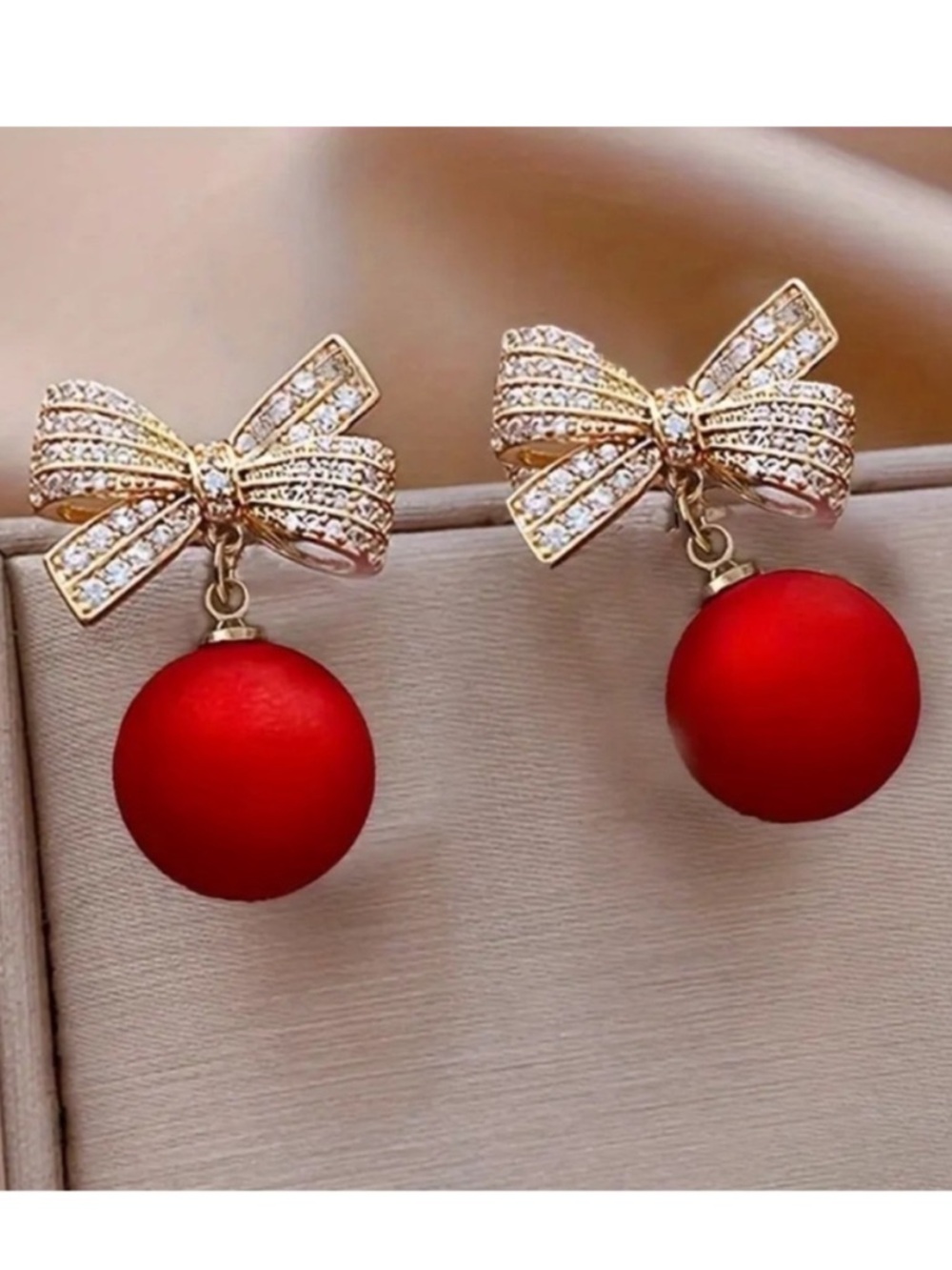 Gold Bow Drop Earrings with Red Pearl Spheres